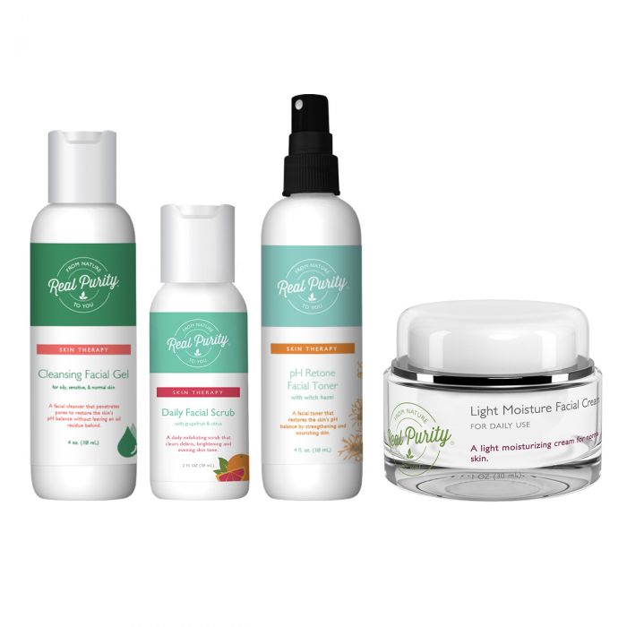 A collection of Real Purity skin care products displayed in front of a beige background, including a cleansing facial gel, facial lotion, daily facial scrub, green tea toner, pH ReTone, and light moisture facial cream, all packaged in white bottles with green labels, accompanied by a beige carrying case.